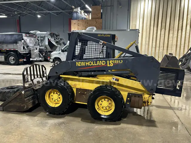 2003 New Holland LS180 skid steer loader