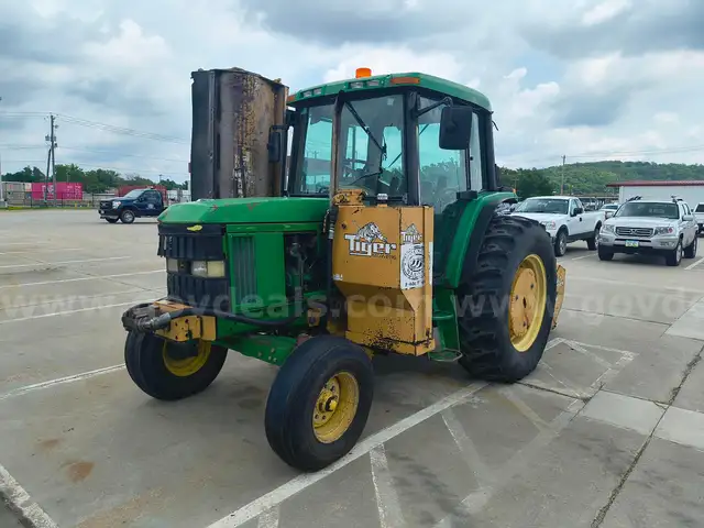 1999 John Deere 6310 with Tiger Mowers