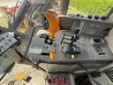 2015 John Deere 6105M tractor with boom mower