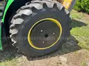 2015 John Deere 6105M tractor with boom mower