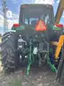 2015 John Deere 6105M tractor with boom mower