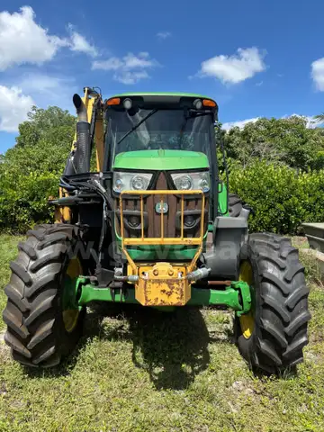 2015 John Deere 6105M tractor with boom mower
