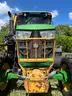 2015 John Deere 6105M tractor with boom mower