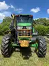 2015 John Deere 6105M tractor with boom mower