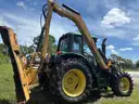 2015 John Deere 6105M tractor with boom mower