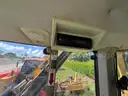 2015 John Deere 6105M tractor with boom mower
