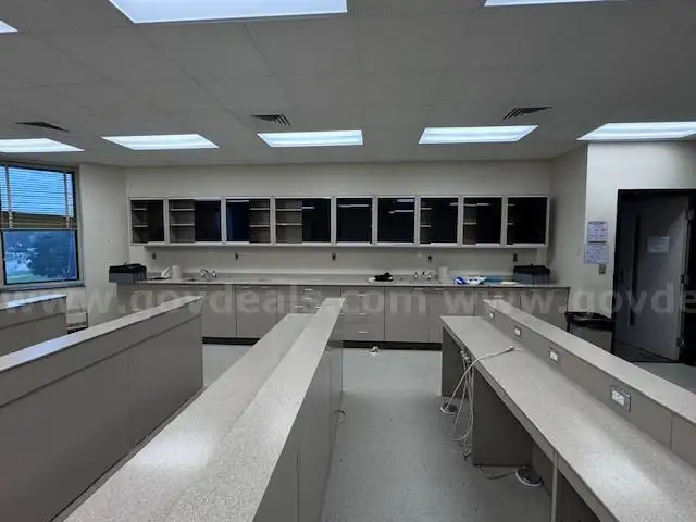 Dental materials metal lab benches  and base and wall cabinets with Corian tops.