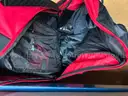 Helmet, back packs, used tools, clothing and new cologne