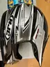 Helmet, back packs, used tools, clothing and new cologne