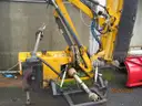 Boom flail mower for Trackless sidewalk tractor.