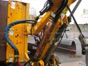 Boom flail mower for Trackless sidewalk tractor.