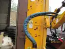 Boom flail mower for Trackless sidewalk tractor.