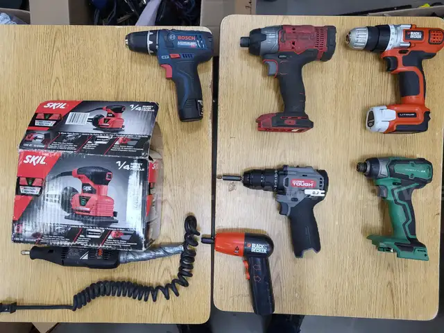Assortment of cordless and corded power tools