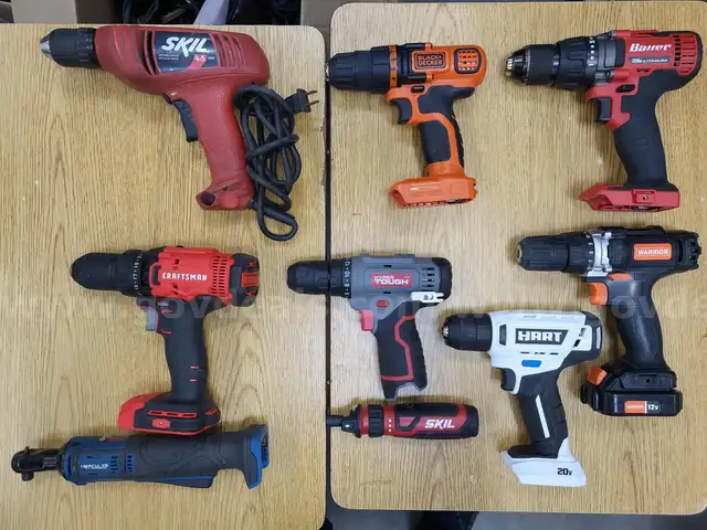 Assortment of cordless and corded power tools