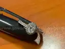 (1) Diamond solitaire ring with (26) smaller sister diamonds stones