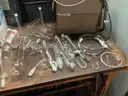 One lot of new and used glass ware and one microscope for parts and service