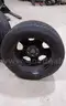 Lot of (4) Firestone Fire-Hawk Pursuit tires (275/55R20 113V M&#x26;S) mounted on Chevrolet 6 bolt stock black rims.