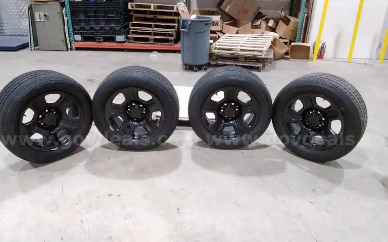 Lot of (4) Firestone Fire-Hawk Pursuit tires (275/55R20 113V M&#x26;S) mounted on Chevrolet 6 bolt stock black rims.