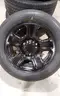 Lot of (4) Firestone Fire-Hawk Pursuit tires (275/55R20 113V M&#x26;S) mounted on Chevrolet 6 bolt stock black rims.