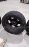 Lot of (4) Firestone Fire-Hawk Pursuit tires (275/55R20 113V M&#x26;S) mounted on Chevrolet 6 bolt stock black rims.