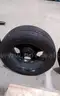 Lot of (4) Firestone Fire-Hawk Pursuit tires (275/55R20 113V M&#x26;S) mounted on Chevrolet 6 bolt stock black rims.