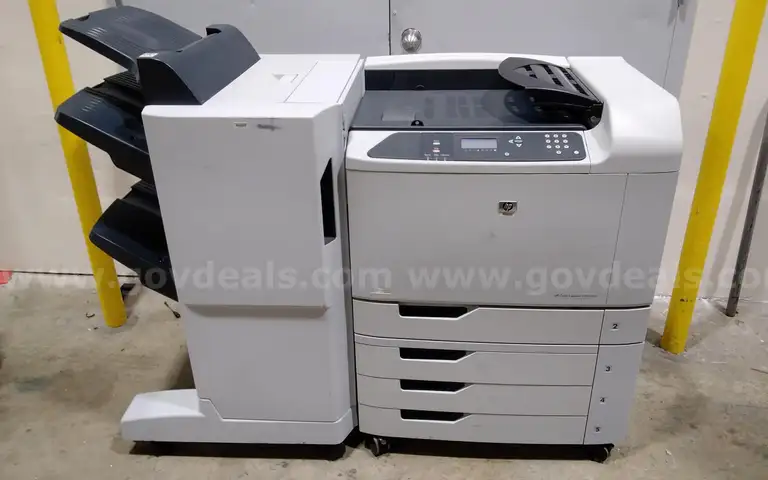 HP color laserjet CP6015xh printer with sorter. For parts or repair