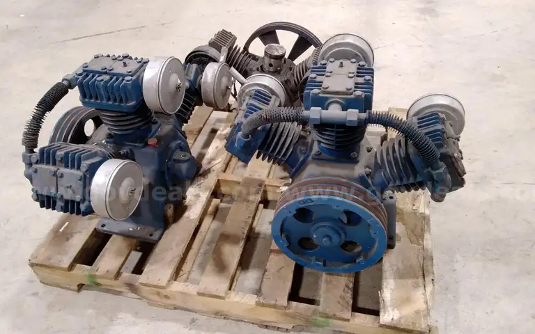 Lot of (3) Air compressor heads. For parts or repair.