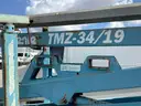 12-2229/ 2000 Genie Tow behind lift. Model: TM2-34/19