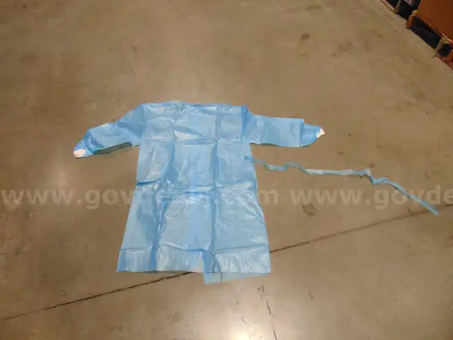 Lot of Non-Surgical isolation gowns with cuffs. All are medium in size. All expired New Old Stock. FD 26-04