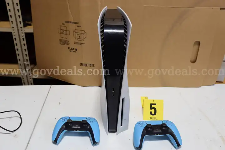 Playstation with light blue controllers