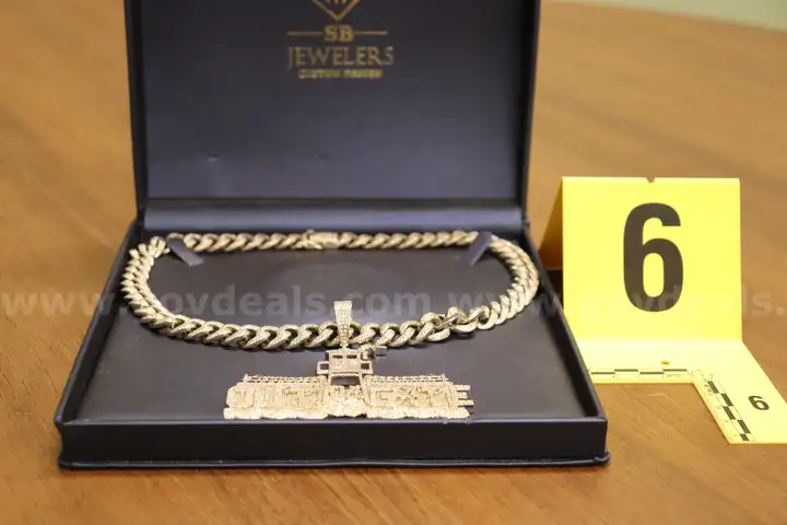 Prison Charm and Silver in color Chain