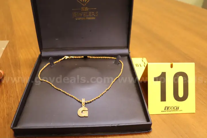 Gold in color chain and pendant "G"