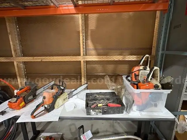 two chainsaws with misc. tools