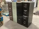 4 - 4 Drawer Filing Cabinets.