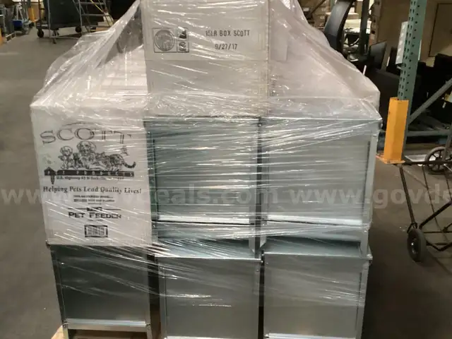 Pallet of Galvanized Pet Feeders.