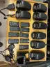 Eight Motorola Impres WPLN4114AR battery chargers with additional accessories