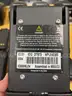 Eight Motorola Impres WPLN4114AR battery chargers with additional accessories
