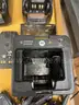 Eight Motorola Impres WPLN4114AR battery chargers with additional accessories