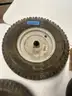 Lot of miscellaneous yard type tires and a box of casters