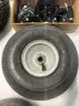Lot of miscellaneous yard type tires and a box of casters