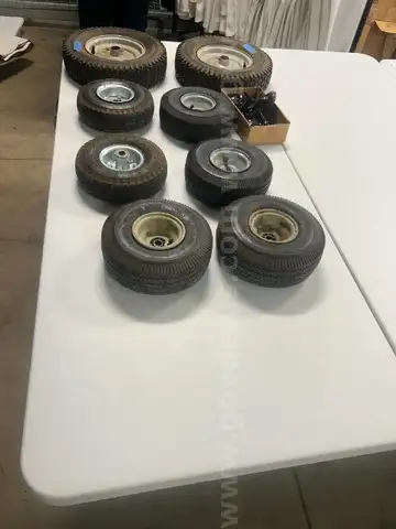Lot of miscellaneous yard type tires and a box of casters