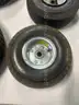 Lot of miscellaneous yard type tires and a box of casters