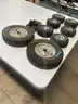 Lot of miscellaneous yard type tires and a box of casters