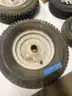 Lot of miscellaneous yard type tires and a box of casters