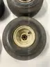 Lot of miscellaneous yard type tires and a box of casters