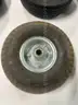Lot of miscellaneous yard type tires and a box of casters