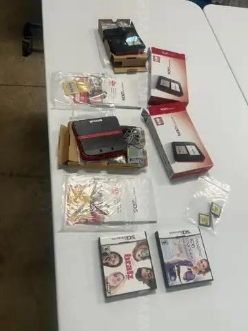 2 Nintendo 2ds and 4 games
