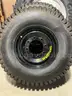 Set of four Skid Steer tires on rims