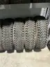 Set of four Skid Steer tires on rims
