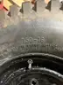 Set of four Skid Steer tires on rims